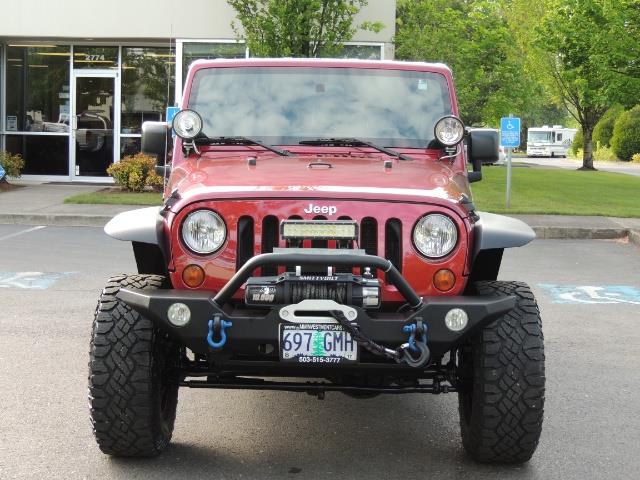 2011 Jeep Wrangler Unlimited Sport / 4X4 / 6-SPEED / LIFTED - Photo 5 - Portland, OR 97217