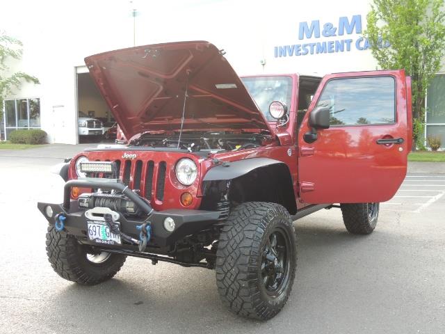 2011 Jeep Wrangler Unlimited Sport / 4X4 / 6-SPEED / LIFTED - Photo 25 - Portland, OR 97217