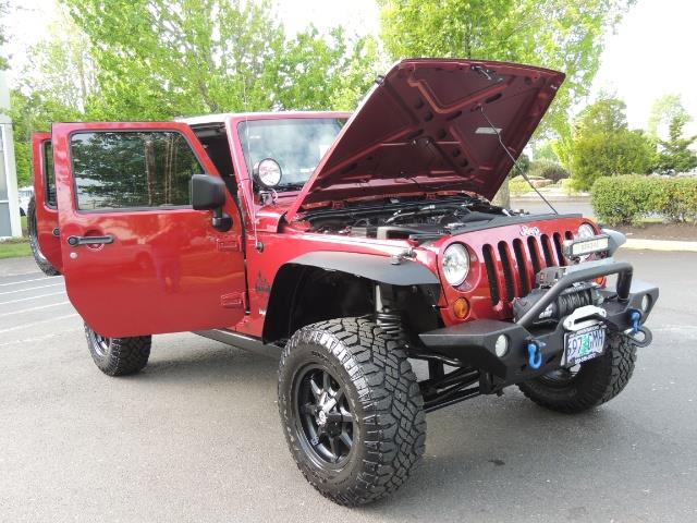 2011 Jeep Wrangler Unlimited Sport / 4X4 / 6-SPEED / LIFTED - Photo 31 - Portland, OR 97217