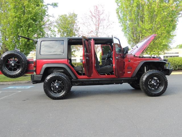 2011 Jeep Wrangler Unlimited Sport / 4X4 / 6-SPEED / LIFTED - Photo 30 - Portland, OR 97217