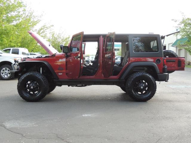 2011 Jeep Wrangler Unlimited Sport / 4X4 / 6-SPEED / LIFTED - Photo 26 - Portland, OR 97217